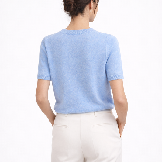 Model wearing Gia Azure Cashmere Short Sleeve Sweater showing the back