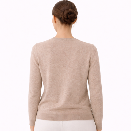 Model wearing Eva V-Neck Cashmere Sweater showing the back of the sweater