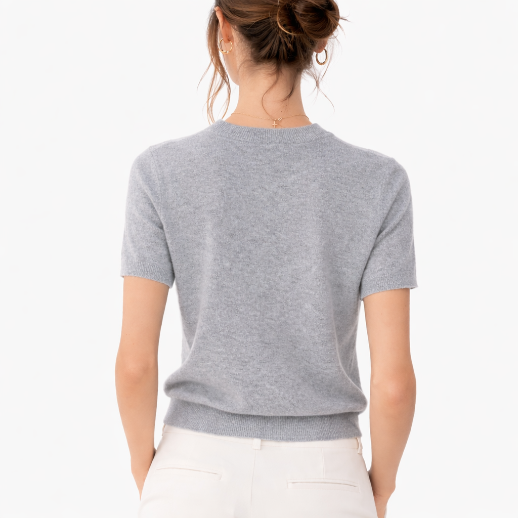 Model wearing Gia Dove Cashmere Short Sleeve Crewneck Sweater showing the back image 