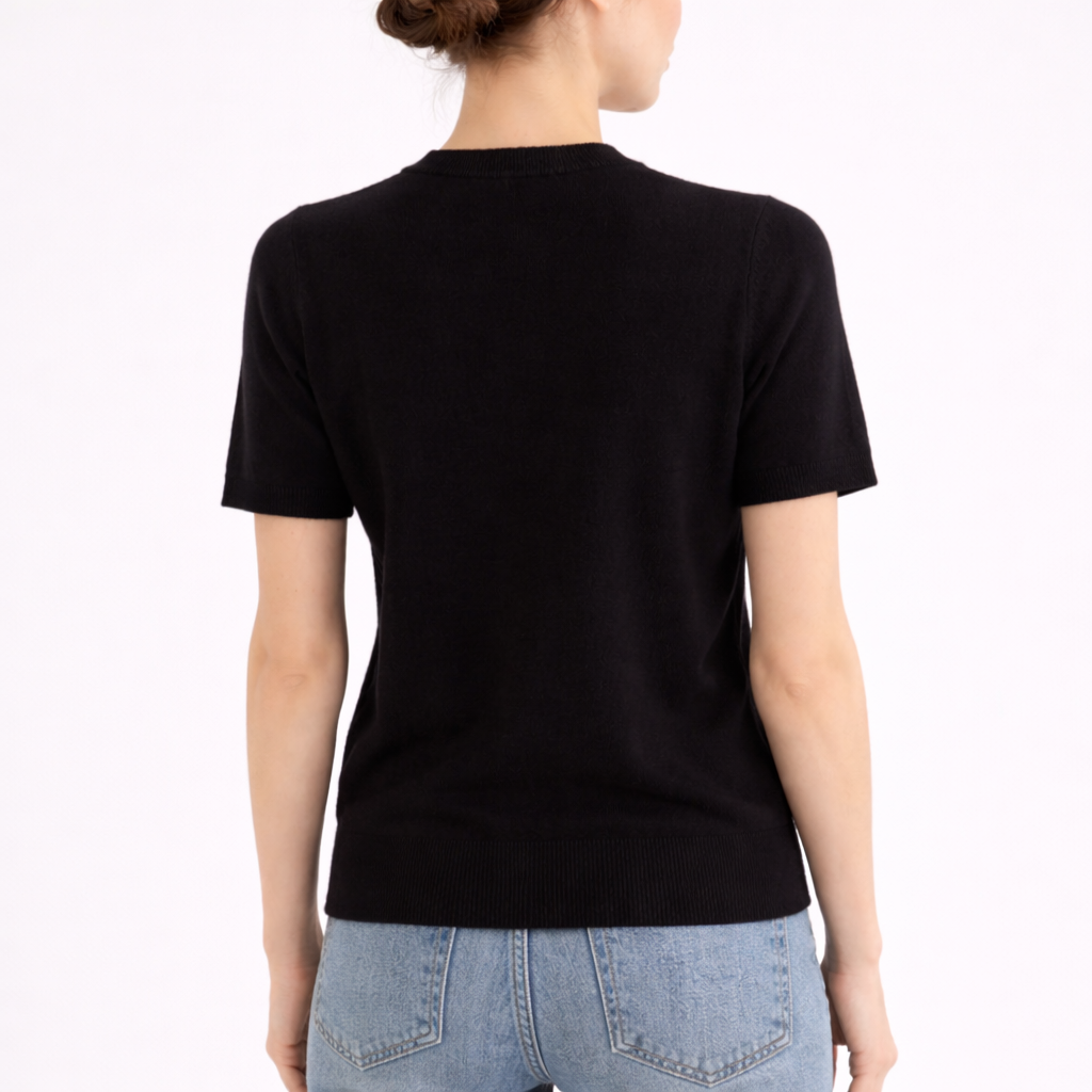 Model wearing Gia Noir Cashmere Short Sleeve Sweater showing the back